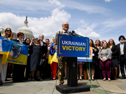 Photo from Brookings: Man speaking at pro-Ukraine event in front of Congress building